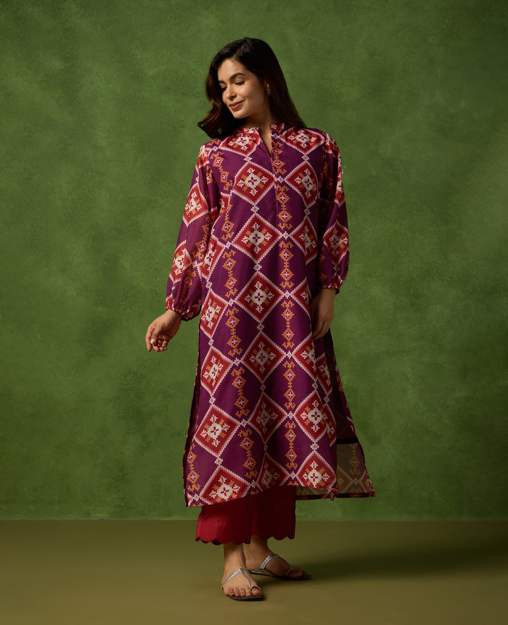 Jhilmil Deep Plum Patola Print Mul Chanderi Kurta Set standing pose - Rare Threads by Naina