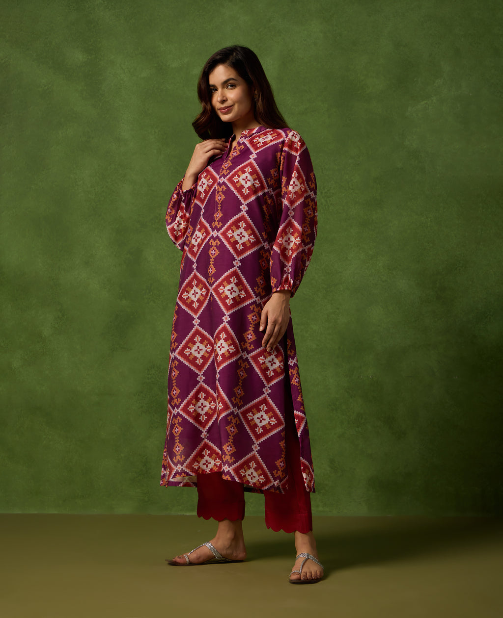 Jhilmil Deep Plum Patola Print Mul Chanderi Kurta Set standing pose - Rare Threads by Naina