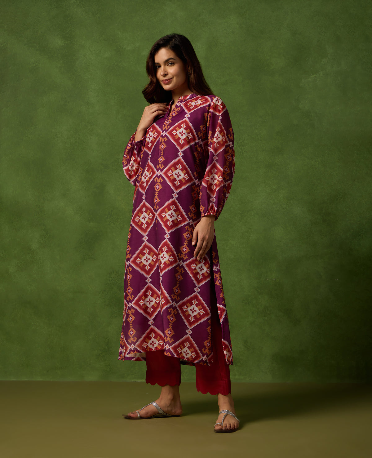 Jhilmil Deep Plum Patola Print Mul Chanderi Kurta Set standing pose - Rare Threads by Naina